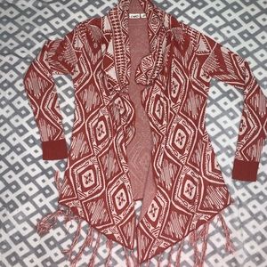 Cardigan, coral in color